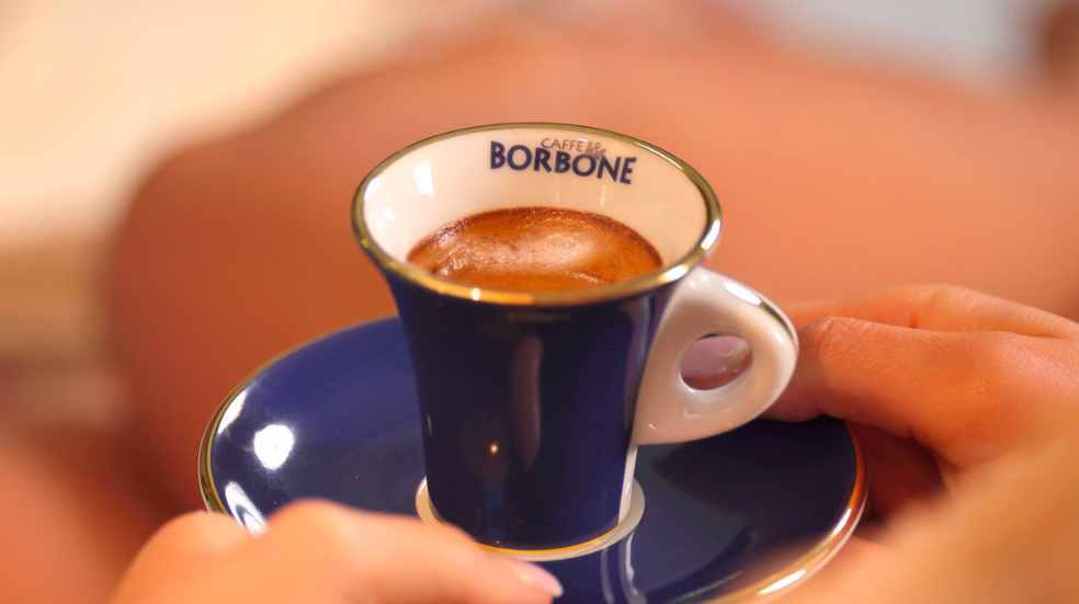 Espresso held by woman - best coffee subscription services