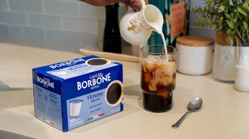 How to Make Iced Coffee with Keurig: Milk poured into a k-cup coffee