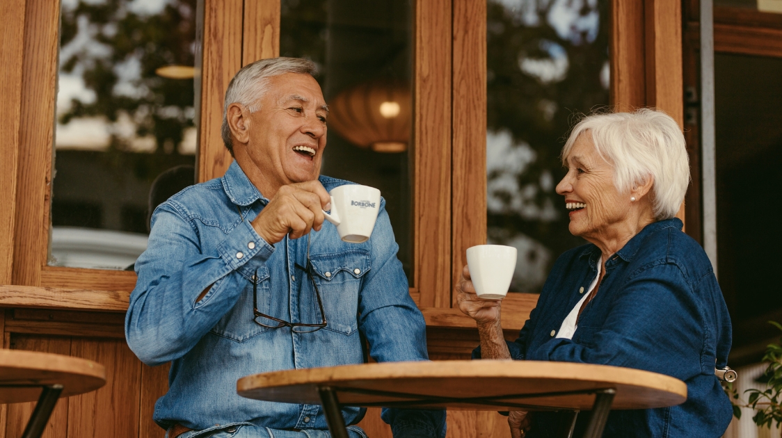 An elderly couple enjoys coffee - is coffee good for heart?