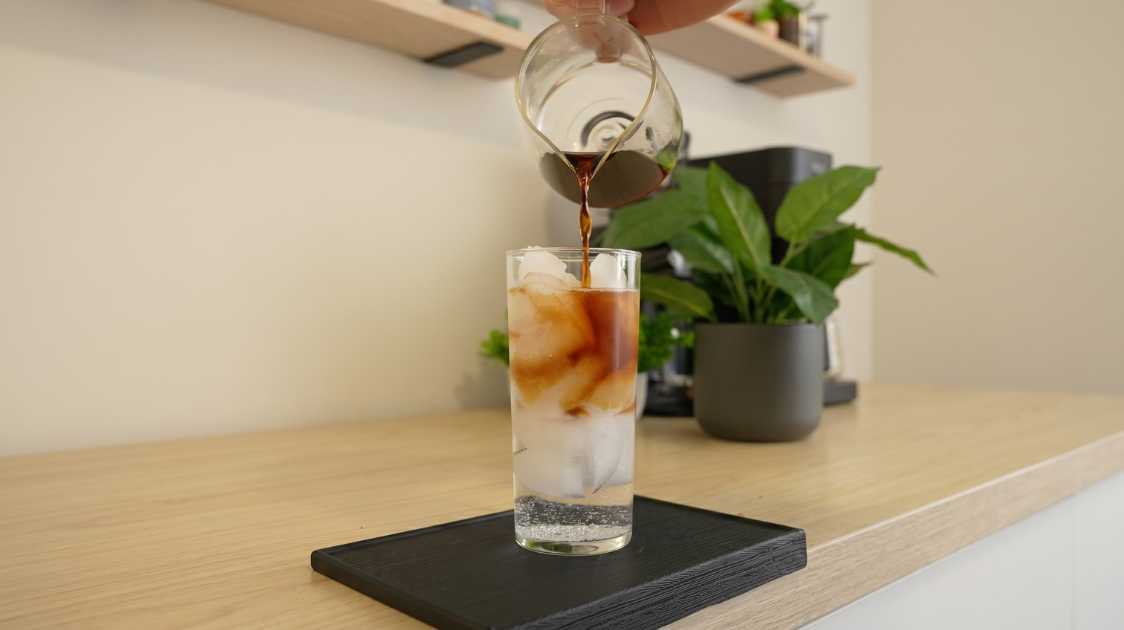 Tonic water espresso being pour into the drink